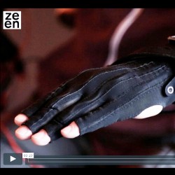 Image from Dezeen video of Kris's hand in black glove with wires