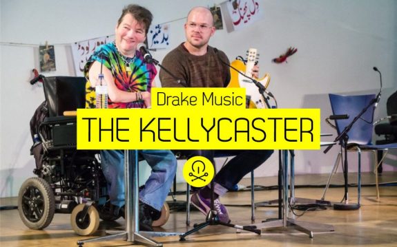 Gawain ad John Kelly present the Kellycaster - image has logo for Music Tech Fest and Kellycaster text added 