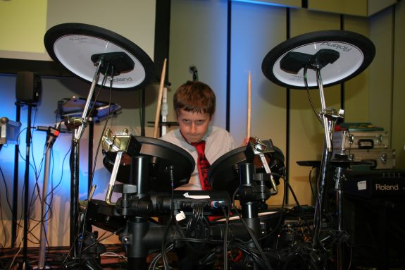Tyler - a talented multi instrumentalist who plays in both 'Explore & 'Evolve' groups playing drums on stage