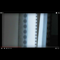 Image: still from video showing close-up edge of window blind