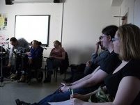 Bradley playing soundbeam surrounded by other pupils