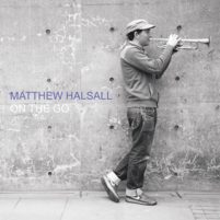 Image: black and white photo of Matthew halsall playing trumpet with text: On The Go
