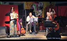 Image: still from video showing 3 musicians playing accordian, melodica and double bass