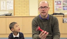 Music leader uses a soundbeam with young musician