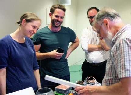 Group of makers discussing kit