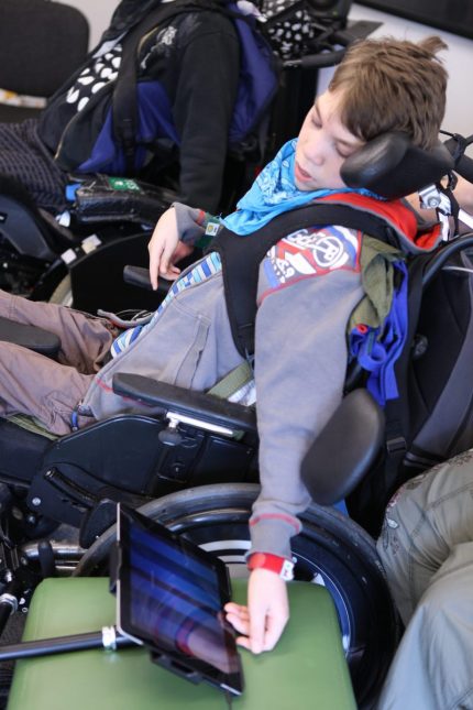Young musician in wheelchair plays Thumbjam iPad app