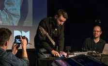 Andreas Lopez plays iPad on stage at ICA, with support from Charles Matthews