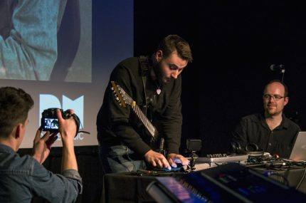 Andreas Lopez plays iPad on stage at ICA, with support from Charles Matthews