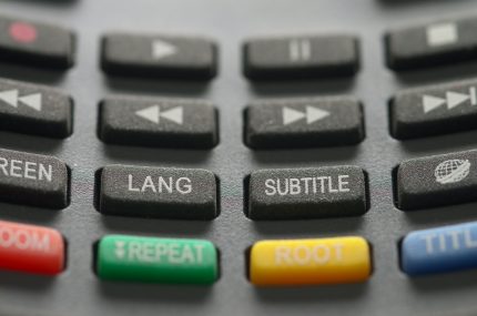 Remote control buttons, one says subtitle