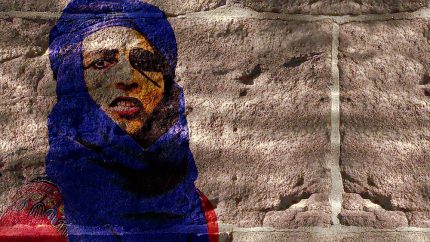 A textured layered image of a person's face, over a wall with light and shadows