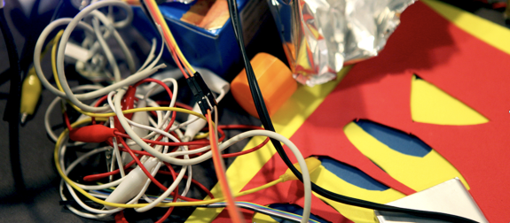 Image of close up wires and colourful paper card