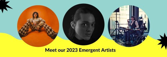 Image of three circles with different people inside. Circle one has a bright orange background and a woman with glasses and curly hair sitting down. Circle two is a black and white portrait of a woman and circle three is a photo of a woman speaking into a microphone who is in a wheelchair. Below is text saying Meet Our 2023 Emergent Artists and the circles are against a turquoise and yellow background. 