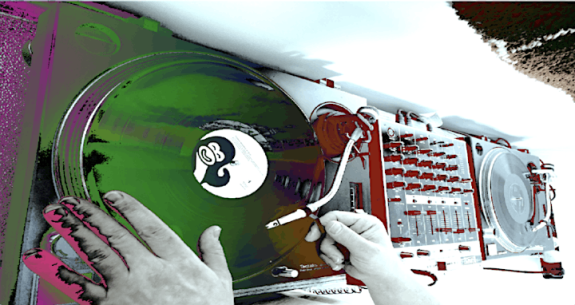 Overhead view of analogue turntables, with added colouring in purple, green, pink and red. Two hands are seen adjusting a record on one of the turntables.