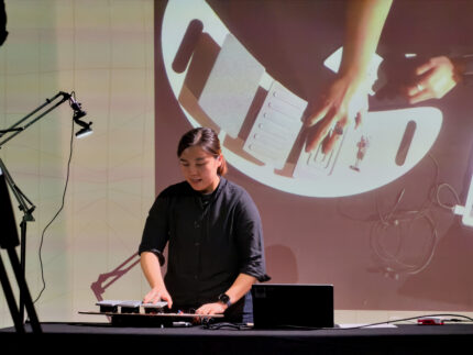 Cheryl presenting her instrument, Sound of Joy, at DMLab Festival.