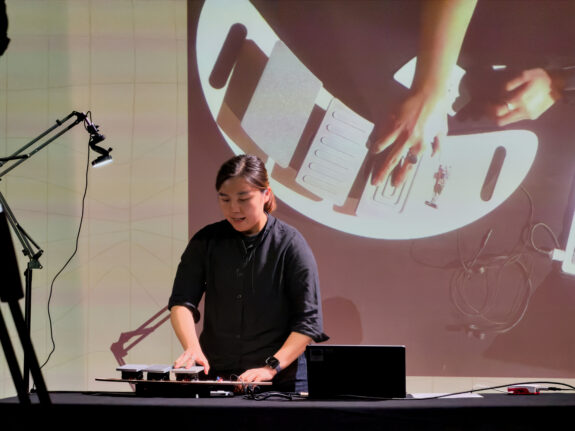 Cheryl presenting her instrument, Sound of Joy, at DMLab Festival.